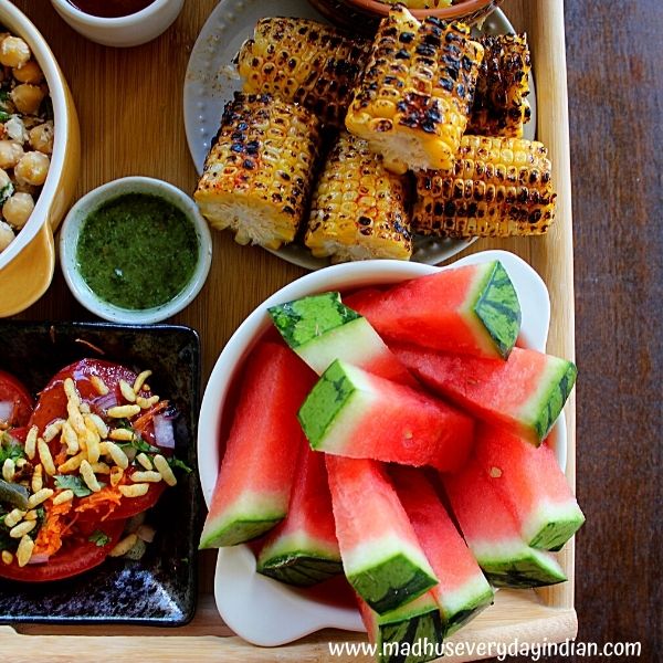 slices of corn and watermelon served in the appetizer board