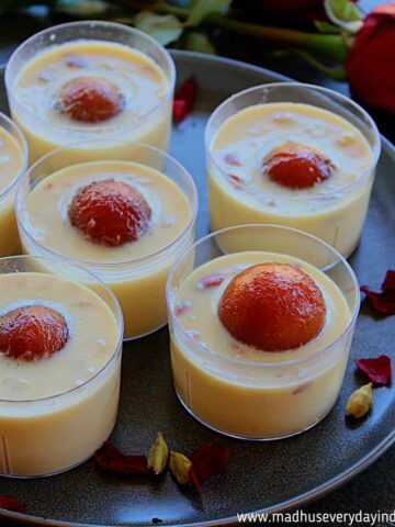 rabdi served in clear cups with gulab jamun