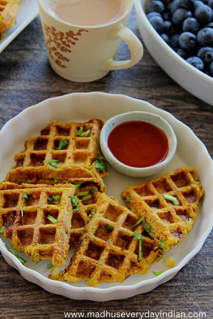 waffles served in a plate with chili sauce and coffee