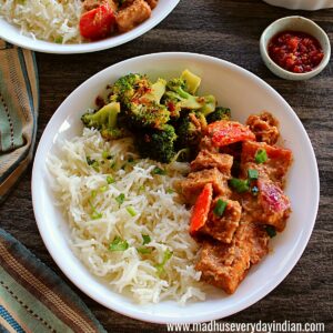rice, tofu stir fry and broccoli served in a white plate