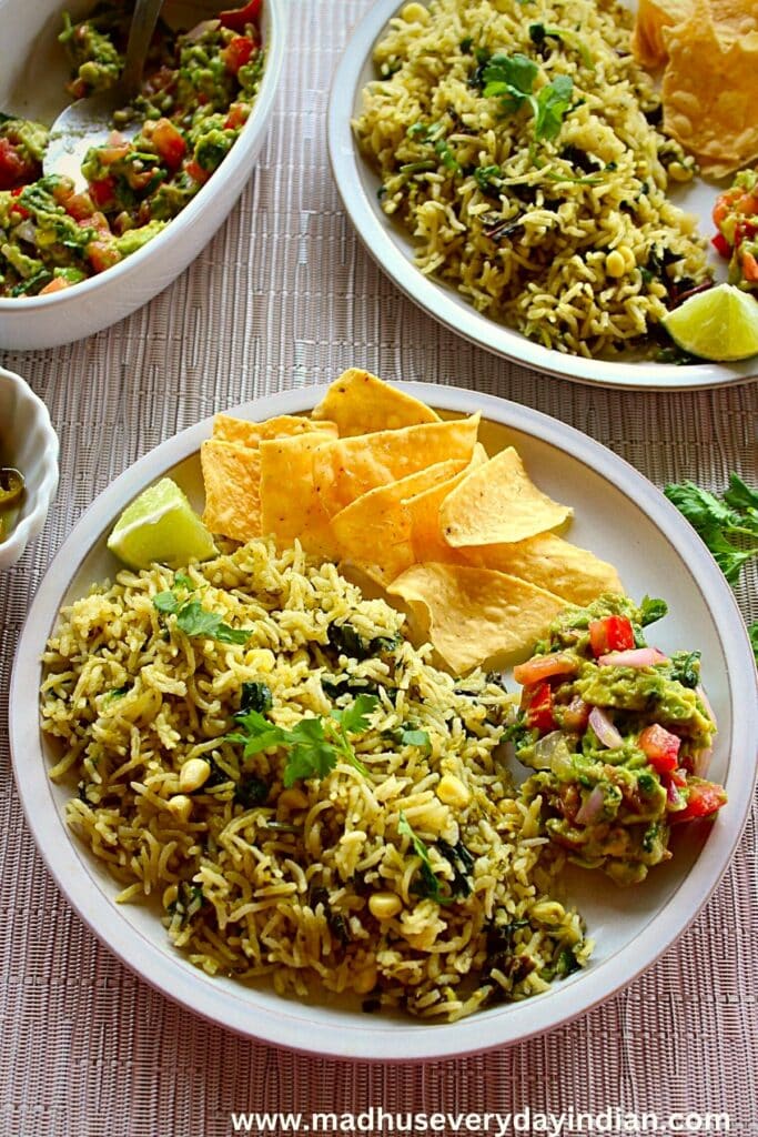 green rice served with tortilla chips and guacamole