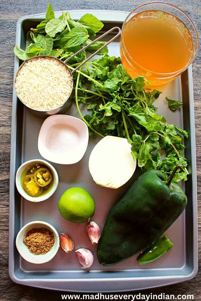 mexican green rice ingredients arranged in a baking tray