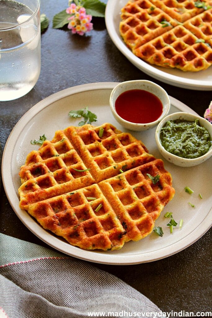 savory red lentil waffles served with chutney and sauce
