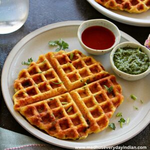savory red lentil waffles served with chutney and sauce