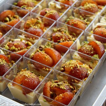 custard gulab jamun cups served in mini cups and arranged in a tray