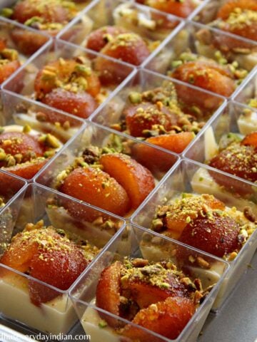 custard gulab jamun cups served in mini cups and arranged in a tray
