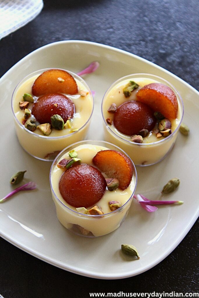 custard gulab jamun serve din mini cups topped with pistachio